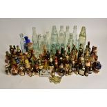 A collection of alcoholic miniatures to include Gordon's Whisky, Gordon's Gin, Martini Dry, and