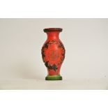 A Chinese red cameo glass vase, with encircling dragons and shou characters, height 15cm