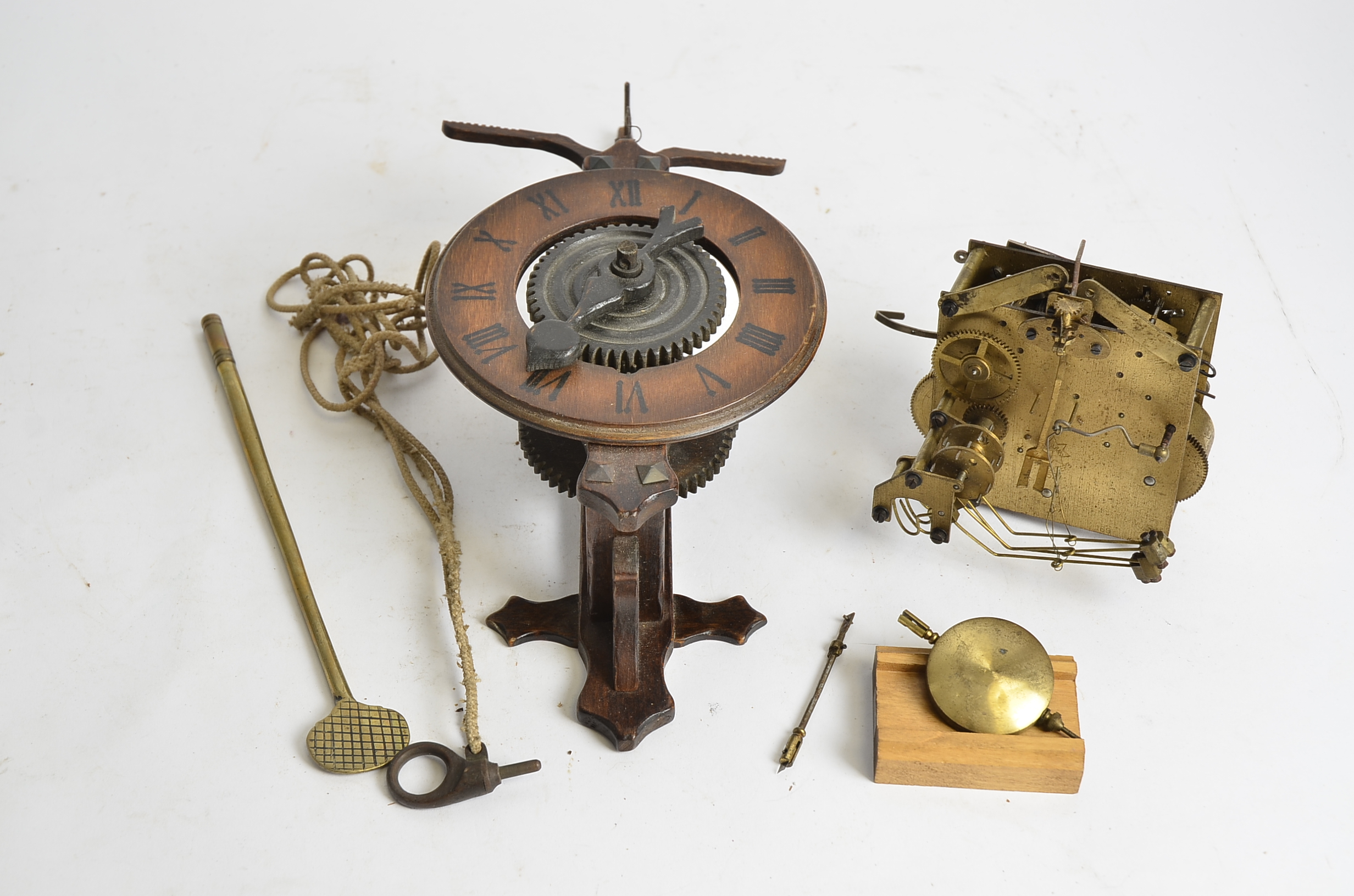 A Black Forest style clock movement, length 37cm, together with another brass clock movement (2) - Image 2 of 2