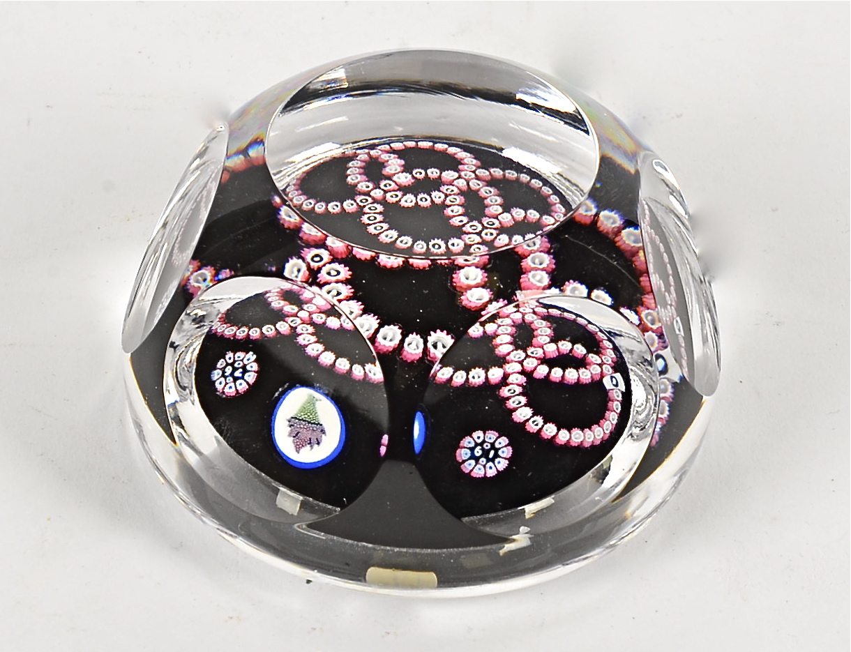 A Whitefriars five ringed glass paperweight' with target design and faceted body, approximate