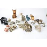 Sixteen figures of cats, to include some examples from the Winstanley pottery, the largest 14cm x