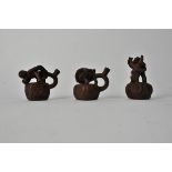 Three South American stoneware erotic figural groups, the tallest 10cm (3)