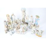 A small collection of Victorian and later figures themed as children with animals, to include a