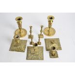A small group of 19th Century and later candlestick holders, including two pairs, one brass and