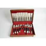 A canteen containing a mid 20th Century Viners stainless steel cutlery service for six, each