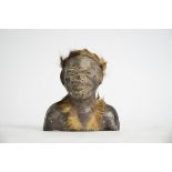 A Zulu ceramic figure with animal fur and beadwork adjournment, height 10cm