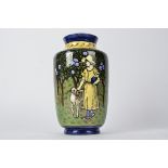 An early 20th Century vase, with hand painted decoration of a female figure walking through an