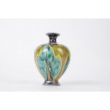 Della Robbia Pottery (Birkenhead 1894-1906), a squat ovoid vase with sgraffito decoration of