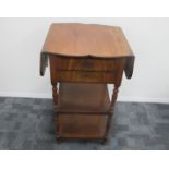 A 19th century mahogany two tier drop flap occasional table, shaped top and flaps, two drawers to