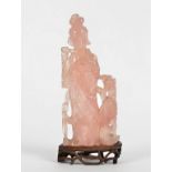 A Chinese rose quartz figure, probably Guanyin, height 23cm, together with a wooden stand, a/f