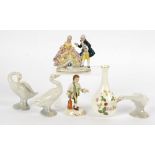 Three Lladro figures of swans, together with a Wedgwood vase in the 'Wild Strawberry' pattern, a