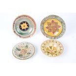 Della Robbia Pottery (Birkenhead 1894-1906), three small shallow earthenware dishes together with