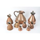 A group of graduated Victorian and later copper jugs, 1/2 gallon, quart, gill, 1/2 pint (9)