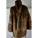 A collection of early 20th Century mink and furs, to include two coats, gloves, stoles and hats (
