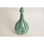 Della Robbia Pottery (Birkenhead 1894-1906), a bulbous vase terminating in a tulip shaped neck, with