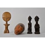 Three tribal art figures, together with a gourd decorated as an Armadillo, functioning as a