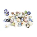 A collection of eggs, to include cloisonné and alabaster examples, (25+)