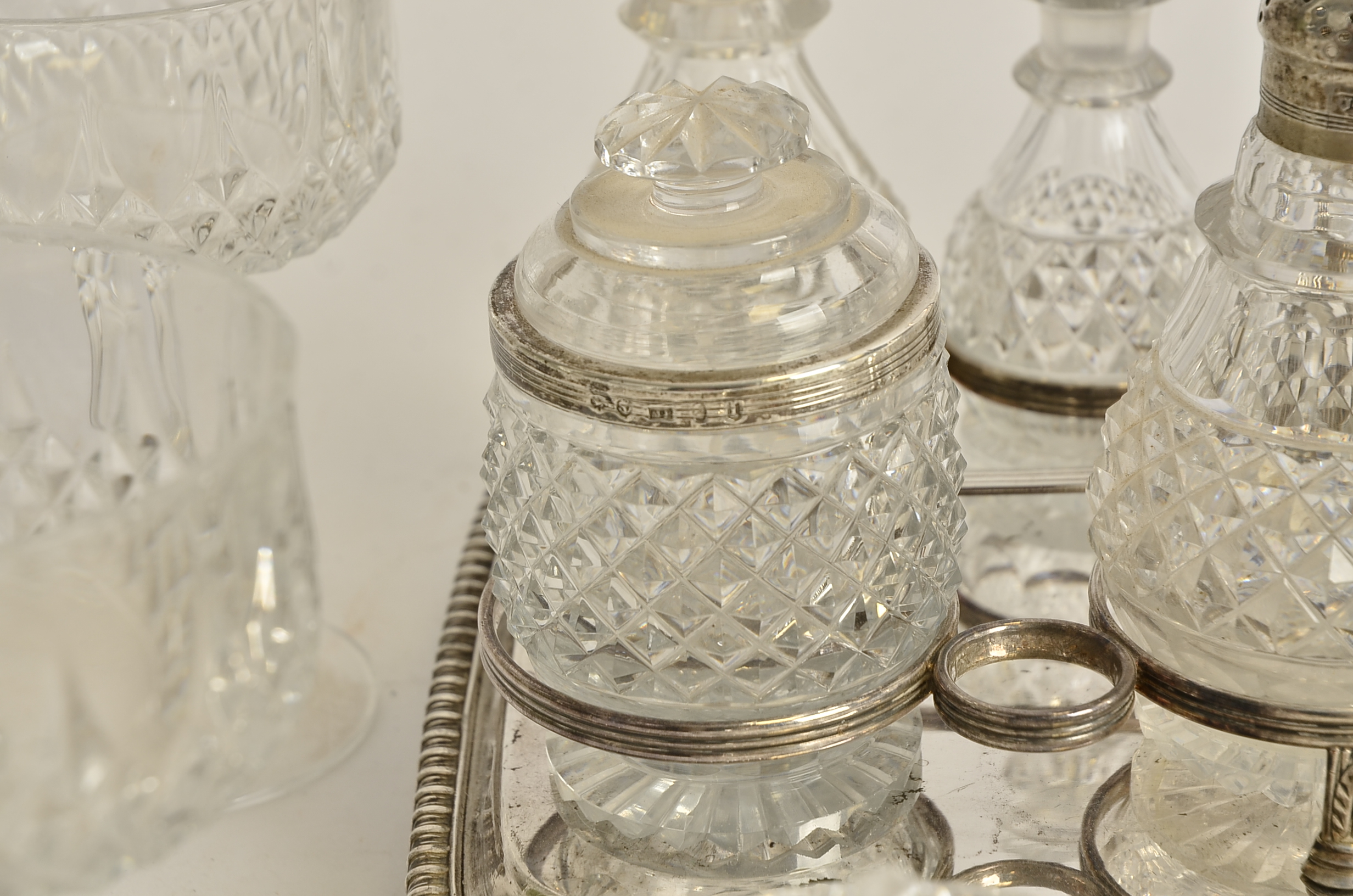 A seven part cruet set on plated stand, with a Georgian pierced silver lid, hallmarked for Sheffield - Image 4 of 5