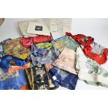 A vintage scarf in its original box, together with a large quantity of loose vintage scarves, to