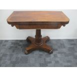 A William IV mahogany tea table, fold over top with swivel action, scroll ends to table rails, round