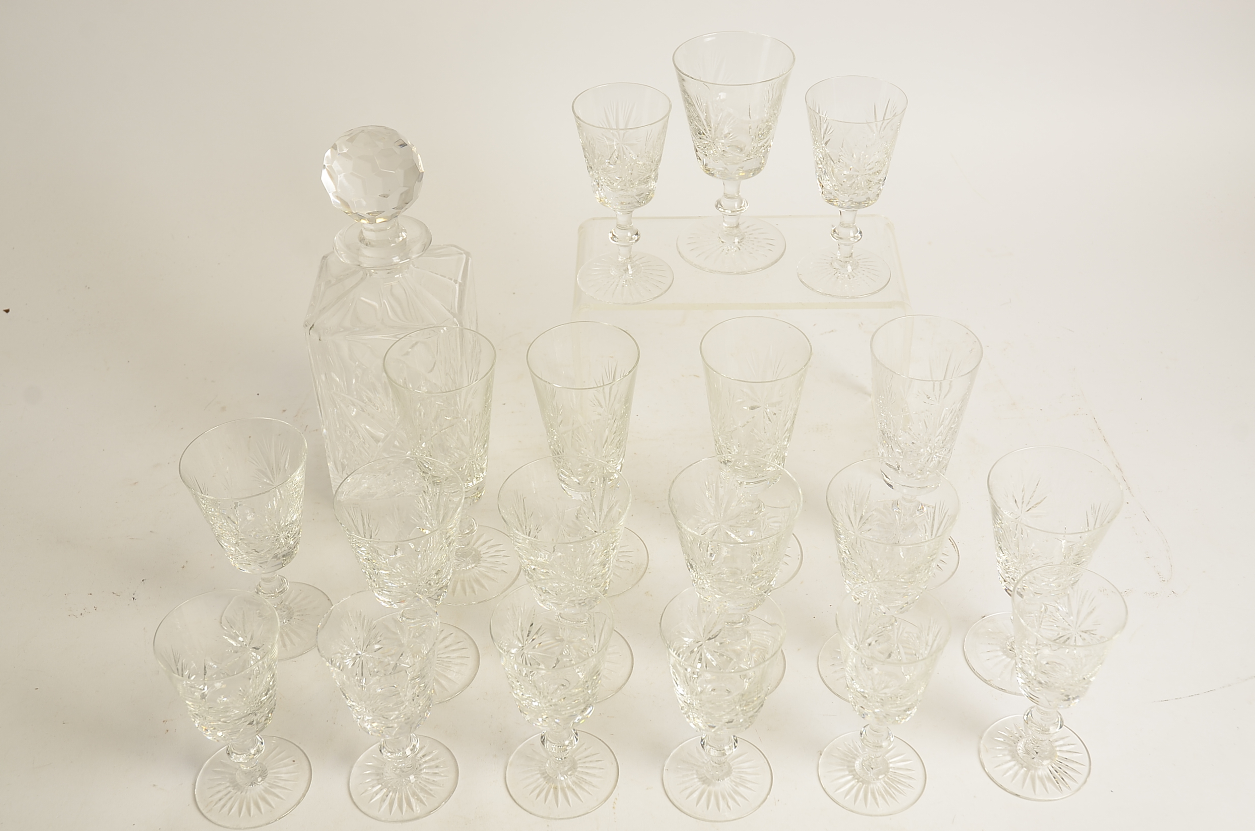 A large quantity of lead crystal drinking glasses, in three different shapes including tumblers (
