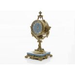 An early 20th century French gilt and porcelain mantle clock, circular case with turquoise porcelain