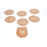 Six stoneware cat coasters, each in the form of a sleeping feline, length 18cm