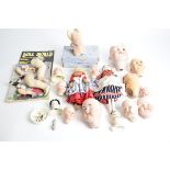 A quantity of Edwardian and later continental bisque dolls heads, eyes and limbs mostly for