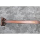 An Art Nouveau mahogany inlayed torche, tapering column with reeded edges, on square stepped base,