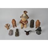 Eight South American and other tribal themed objects, to include a whistle in the form of a mythical