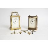 Two brass carriage timepieces, one marked 'Henley', the other 'Dominion', total height of tallest