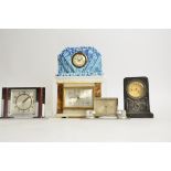 A collection of five Art Deco mantel clocks, comprising two in chromed metal, one in marble, another