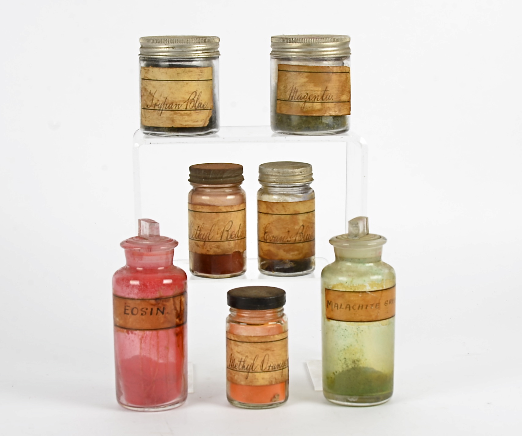 A group of Victorian novelty bottles, with original contents, colourful powders and pigments from