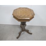 A Victorian octagonal walnut sewing table, rising top with parquetry and marquetry chequered