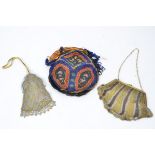 An early 20th Century beadwork bag, 20cm x 14cm, excluding the fringes, together with two mesh