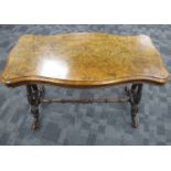 A 19th century burr walnut centre table, figured serpentine shaped moulded top above a shaped