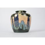 A 1930's vase by Royal Doulton, with stylised trees at dusk or dawn, with Royal Doulton lion and