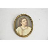 A continental porcelain plaque of a young Jesus, of oval shape, 13cm x 9.5cm