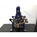A late Victorian or Edwardian tower clock movement, in blue painted cast iron A frame, lacks most