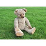 Cuthbert a Terrys teddy bear circa 1920, with blonde mohair, clear and black oily glass eyes with