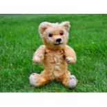 Thurleigh a British United Manufacturing Co Ltd Omega teddy bear 1930s, with golden mohair, orange