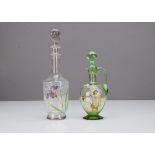 Two Mont Joye decanters and stoppers, one with mauve iris decoration against an acid etched floral