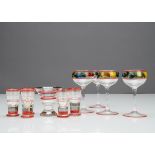 A set of four painted glass liquor glasses, decorated with fruit with red banding, 12cm, a banded