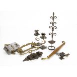 A miscellaneous collection of metalware, including a pair of Arts and Crafts candlesticks with