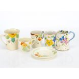 Four Art Deco hand painted pottery mugs, one by Hancocks for the ivory ware range, another by Adams,