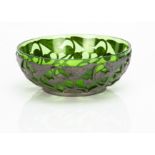 A continental Art Nouveau pewter bowl with green glass liner, the pewter bowl with all over stylised