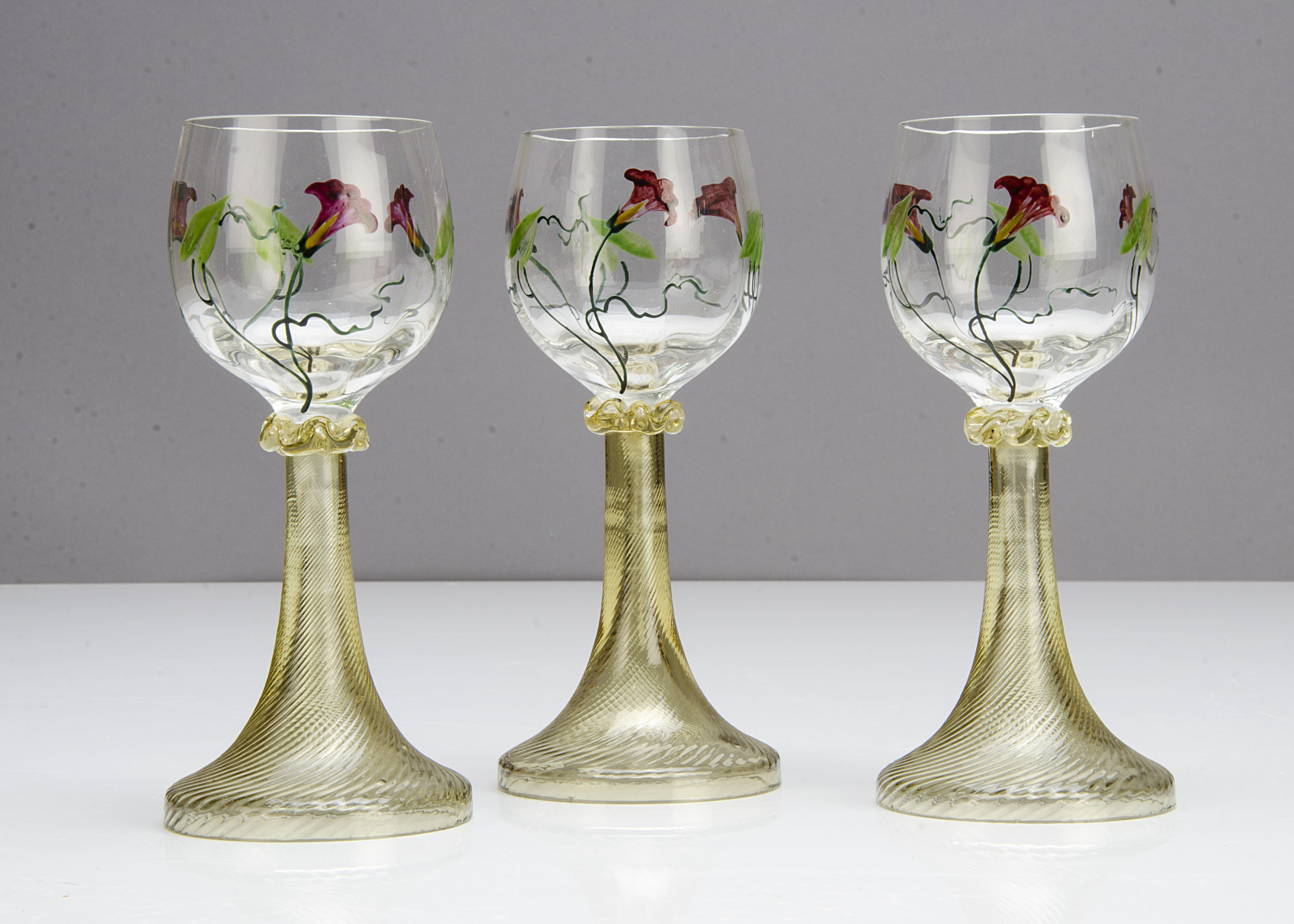 A set of three German Art Nouveau hock glasses in the Theresienthal style, the bowls with painted