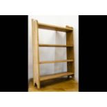 A pine hanging set of four shelves, 54cm wide x 14cm deep x 78cm high In general good condition