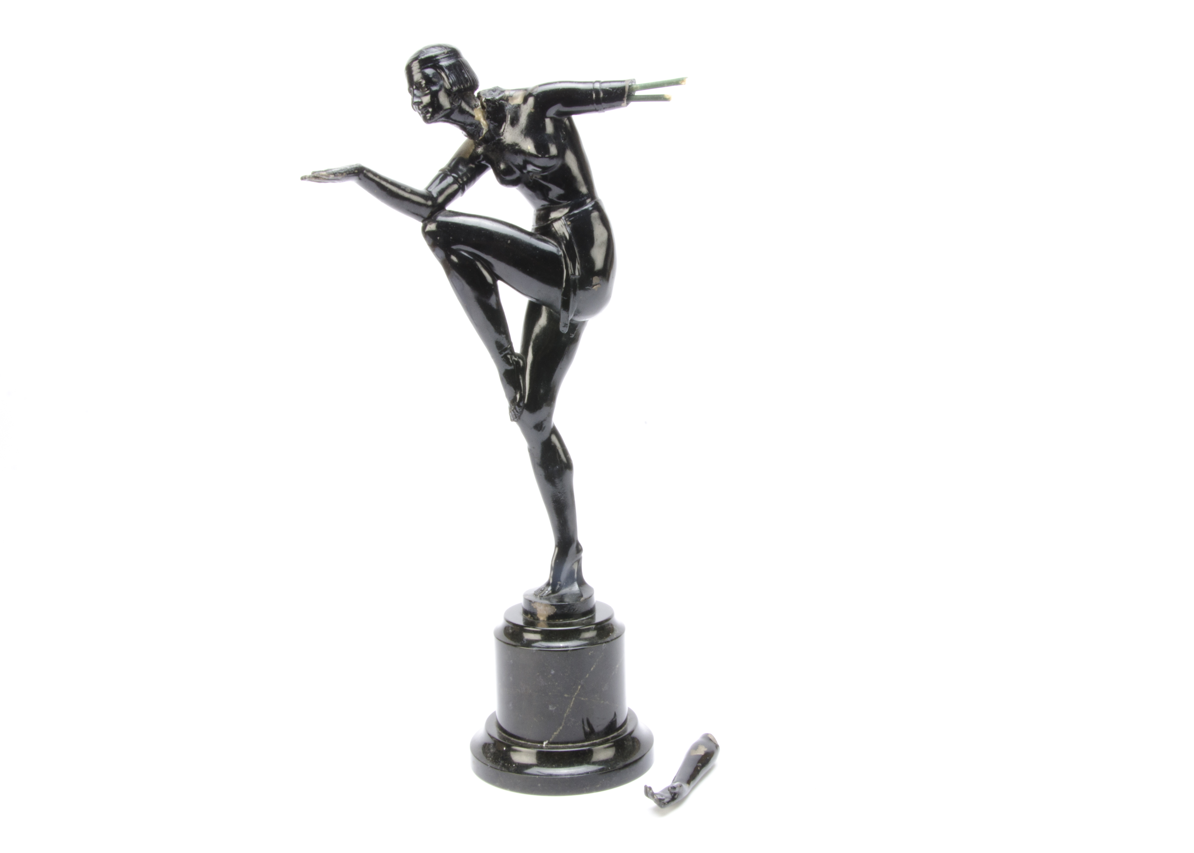 A spelter Art Deco figure, modelled as a female dancer in the Egyptian style standing on one leg