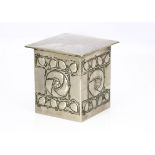 A Scottish school influenced pewter and tin biscuit box, with cushion shaped hinged lid, the